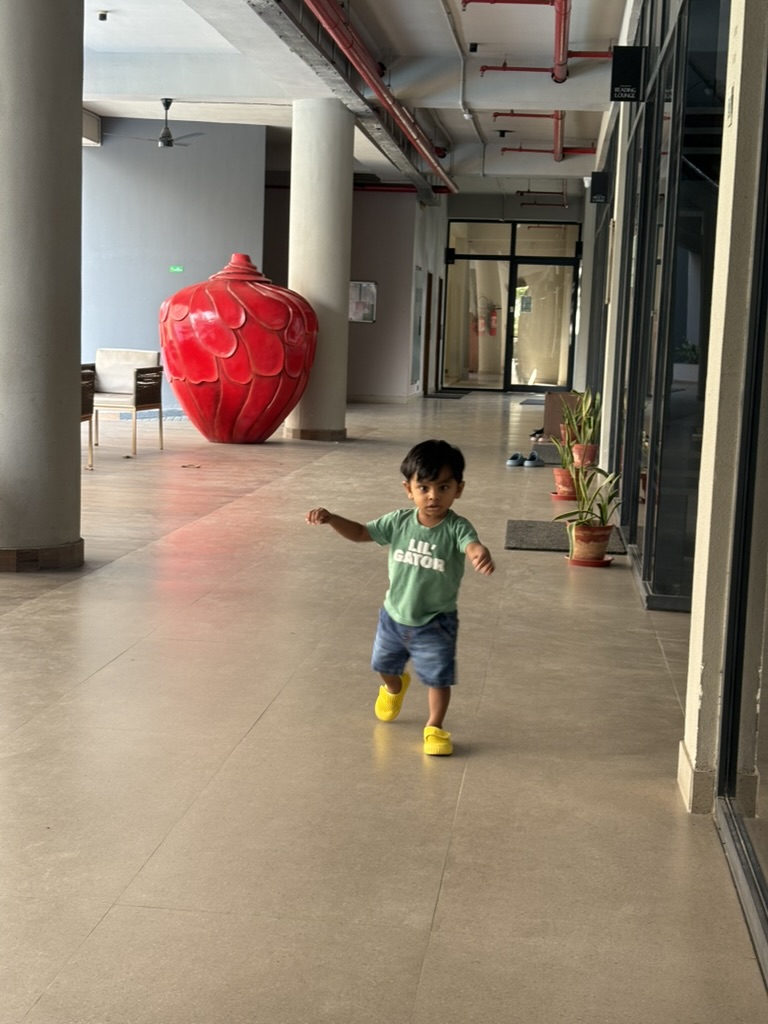 Satyartha walking down a hallway